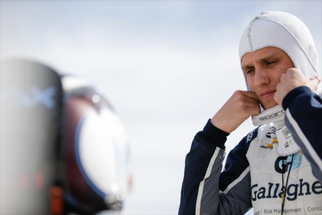 Max Chilton adjusts his balaclava along pit lane during the afternoon open test session at ISM Raceway -- Photo by: Shawn Gritzmacher