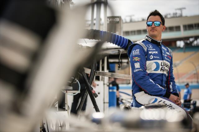 Graham Rahal sits along pit lane prior to the start of the evening test session at ISM Raceway -- Photo by: Shawn Gritzmacher