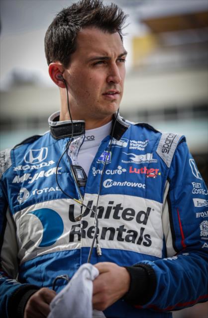 Graham Rahal looks down pit lane prior to the start of the evening test session at ISM Raceway -- Photo by: Shawn Gritzmacher