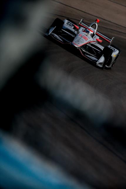 Will Power sails into Turn 3 during the evening test session at ISM Raceway -- Photo by: Shawn Gritzmacher