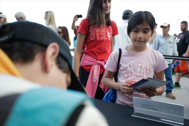 A young fan waits for her autograph from Gabby Chaves during the autograph session at ISM Raceway -- Photo by: Shawn Gritzmacher