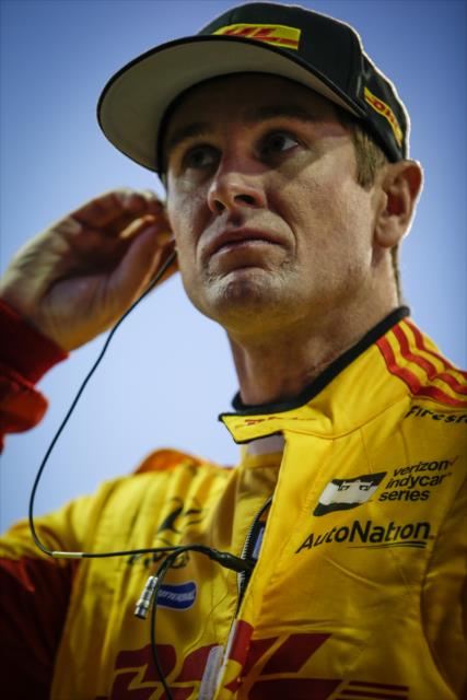 Ryan Hunter-Reay sets his earpieces along pit lane during the evening test session at ISM Raceway -- Photo by: Shawn Gritzmacher
