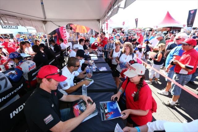 Fans line up for autographs in the INDYCAR Fan Village at Pocono Raceway -- Photo by: Bret Kelley