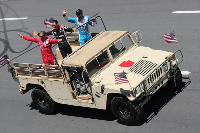 Tony Kanaan, Helio Castroneves, and James Hinchcliffe wave to the crowd prior to the start of the Pocono INDYCAR 500 -- Photo by: Bret Kelley