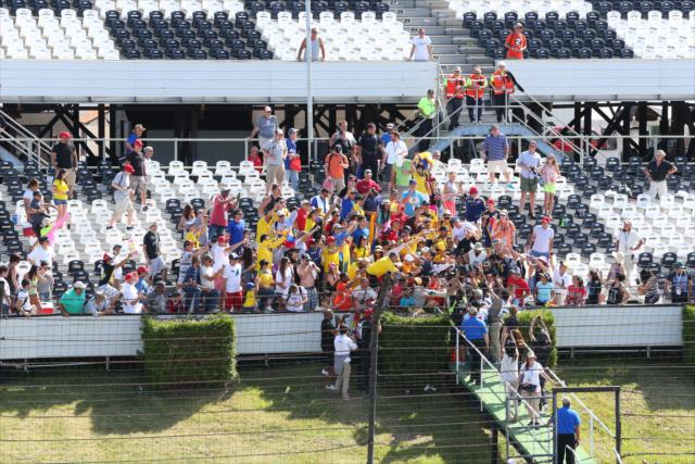 Juan Pablo Montoya and Carlos Munoz join their Colombian supporters in the stands. -- Photo by: Bret Kelley