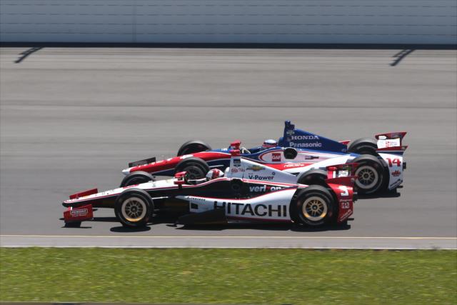 Helio Castroneves and Takuma Sato go side-by-side during the Pocono INDYCAR 500 at Pocono Raceway -- Photo by: Chris Jones