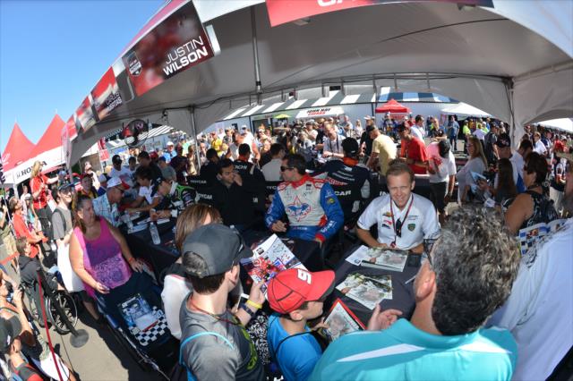 Fans line up for autographs in the INDYCAR Fan Village at Pocono Raceway -- Photo by: Chris Owens