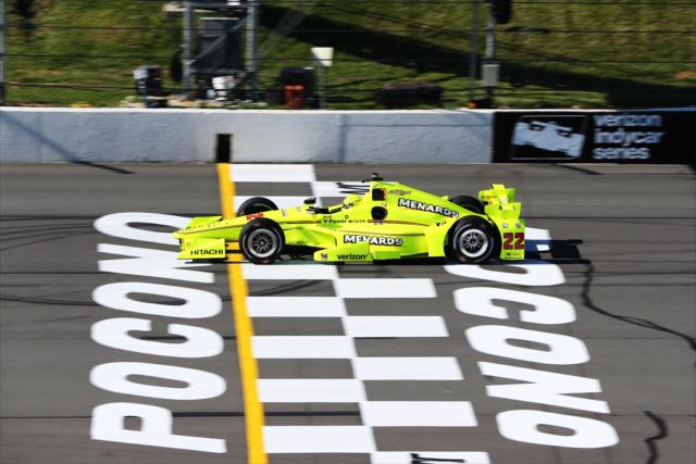 Simon Pagenaud flashes across the start/finish line during practice for the ABC Supply 500 at Pocono Raceway -- Photo by: Chris Jones