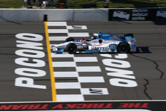 Marco Andretti flashes across the start/finish line during practice for the ABC Supply 500 at Pocono Raceway -- Photo by: Chris Jones