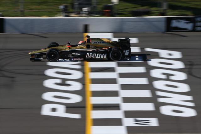 James Hinchcliffe flashes across the start/finish line during practice for the ABC Supply 500 at Pocono Raceway -- Photo by: Chris Jones