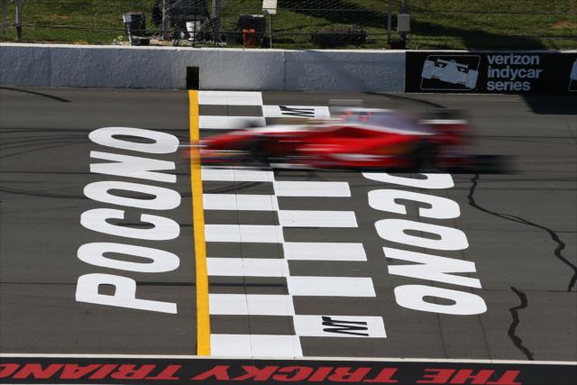 Carlos Munoz flashes across the start/finish line during practice for the ABC Supply 500 at Pocono Raceway -- Photo by: Chris Jones