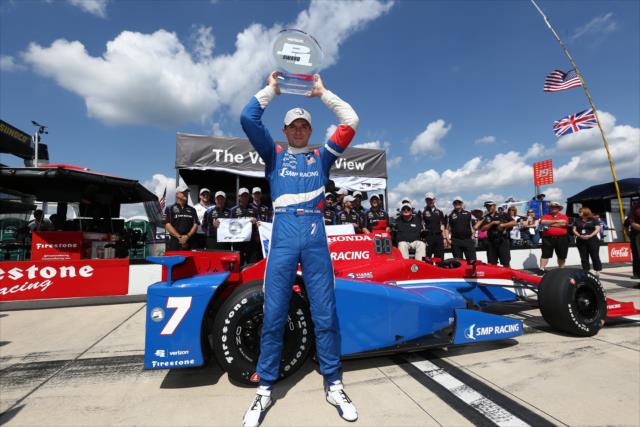 Mikhail Aleshin hoists the Verizon P1 Award trophy after winning the pole position for the ABC Supply 500 at Pocono Raceway -- Photo by: Chris Jones
