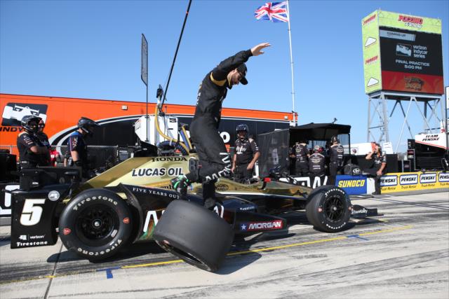 James Hinchcliffe with some artistic gymnastics on pit lane prior to the evening practice for the ABC Supply 500 at Pocono Raceway -- Photo by: Chris Jones