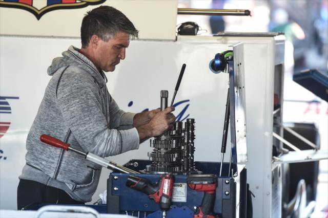 An A.J. Foyt Enterprises engineer prepares a gear stack back in the paddock area at Pocono Raceway -- Photo by: Chris Owens