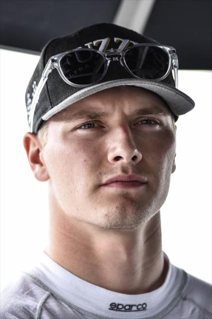 Josef Newgarden reviews data in his pit stand following practice for the ABC Supply 500 at Pocono Raceway -- Photo by: Chris Owens