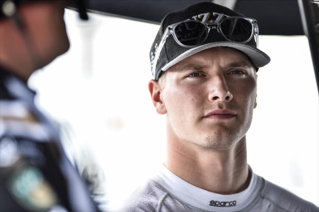Josef Newgarden looks over telemetry data in his team's pit stand following practice for the ABC Supply 500 at Pocono Raceway -- Photo by: Chris Owens