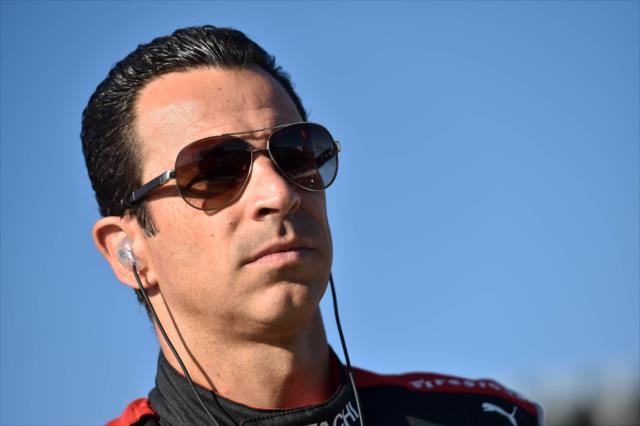 Helio Castroneves looks down pit lane prior to practice for the ABC Supply 500 at Pocono Raceway -- Photo by: Chris Owens