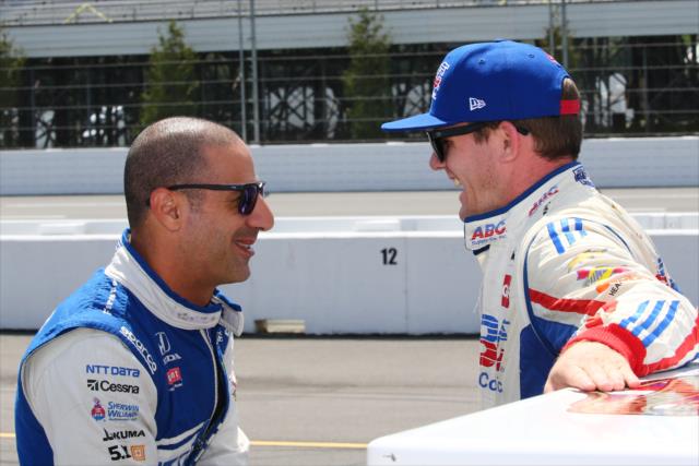 Tony Kanaan and Conor Daly chat on pit lane prior to qualifications for the ABC Supply 500 at Pocono Raceway -- Photo by: Bret Kelley