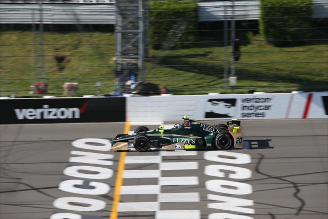 Ed Carpenter flashes across the start/finish line during practice for the ABC Supply 500 at Pocono Raceway -- Photo by: Chris Jones