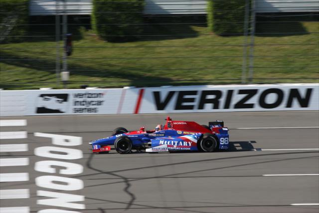 Alexander Rossi flashes across the start/finish line during practice for the ABC Supply 500 at Pocono Raceway -- Photo by: Chris Jones