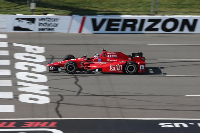 Graham Rahal streaks across the start/finish line during practice for the ABC Supply 500 at Pocono Raceway -- Photo by: Chris Jones