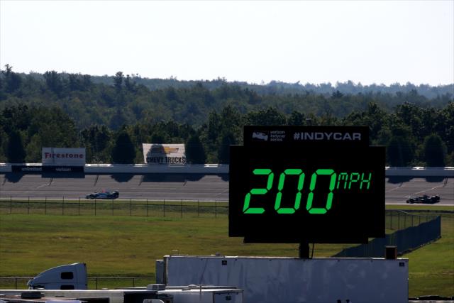 Cars roll through Turn 1 during practice for the ABC Supply 500 at Pocono Raceway -- Photo by: Chris Jones