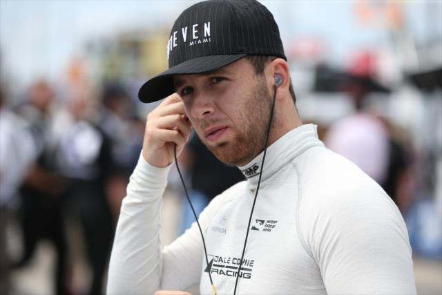 Ed Jones sets his earpieces along pit lane prior to his qualification attempt for the ABC Supply 500 at Pocono Raceway -- Photo by: Chris Jones