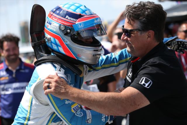 Michael Andretti congratulates Takuma Sato on pit lane after winning the pole position for the ABC Supply 500 at Pocono Raceway -- Photo by: Chris Jones