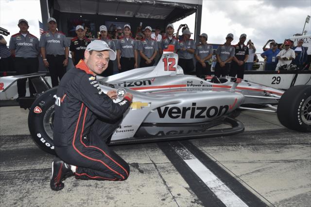 Will Power affixes the Verizon P1 Award emblem on his car after winning the pole for the ABC Supply 500 at Pocono Raceway -- Photo by: Chris Owens