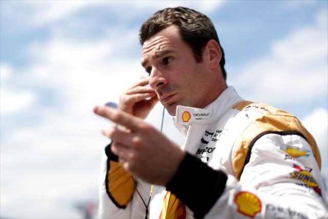 Simon Pagenaud sets his earpieces along pit lane prior to practice for the ABC Supply 500 at Pocono Raceway -- Photo by: Joe Skibinski