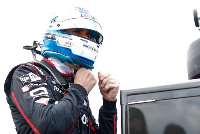 Robert Wickens straps on his helmet along pit lane prior to practice for the ABC Supply 500 at Pocono Raceway -- Photo by: Joe Skibinski