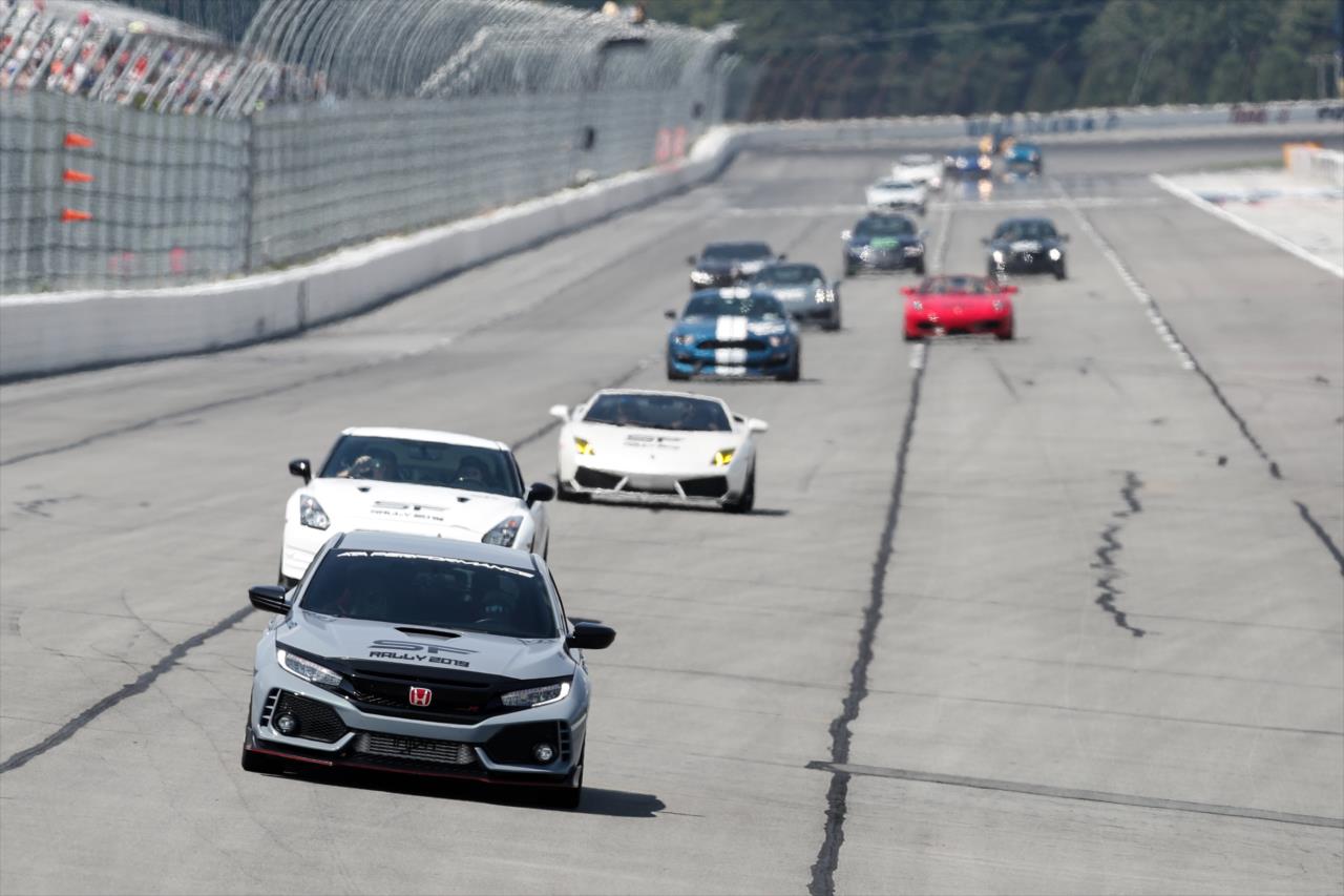Santino Ferrucci leads a pack of cars around Pocono Raceway during a charity rally benefiting Dream Ride and Hometown Foundation -- Photo by: Joe Skibinski