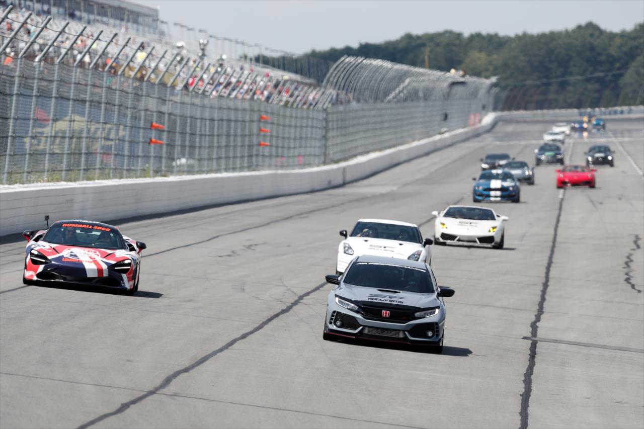 Santino Ferrucci leads a pack of cars around Pocono Raceway during a charity rally benefiting Dream Ride and Hometown Foundation -- Photo by: Joe Skibinski