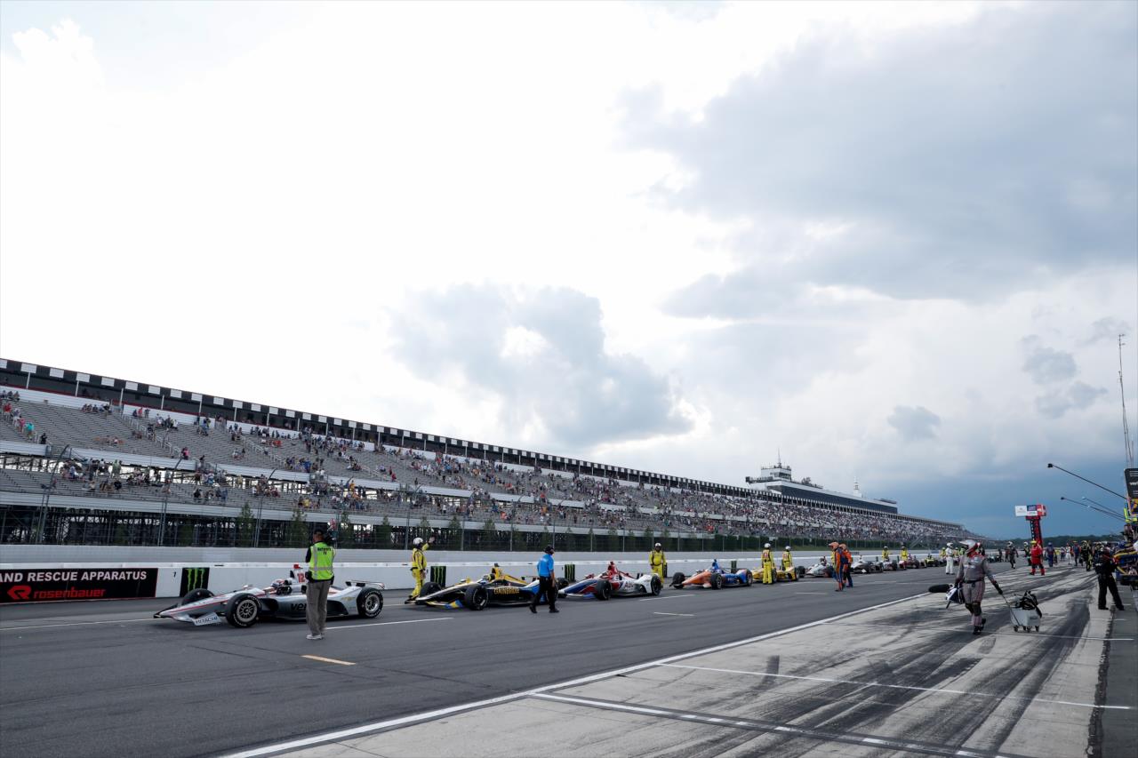 Cars sitting on pit lane under red-flag conditions  -- Photo by: Joe Skibinski