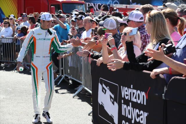 Alfonso Celis Jr. greets the fans around the stage during pre-race festivities for the Grand Prix of Portland at Portland International Raceway -- Photo by: Chris Jones