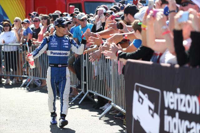 Takuma Sato greets the fans gathered at the stage during pre-race festivities for the Grand Prix of Portland at Portland International Raceway -- Photo by: Chris Jones