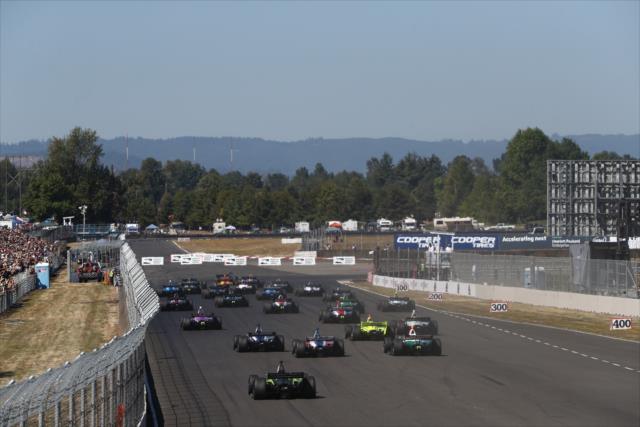 The field streams into the Festival Curves into Turn 1 to start the Grand Prix of Portland at Portland International Raceway -- Photo by: Chris Jones