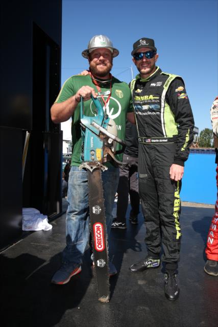 Timber Joey of the MLS Portland Timbers with Charlie Kimball on stage during pre-race festivities for the Grand Prix of Portland at Portland International Raceway -- Photo by: Chris Jones