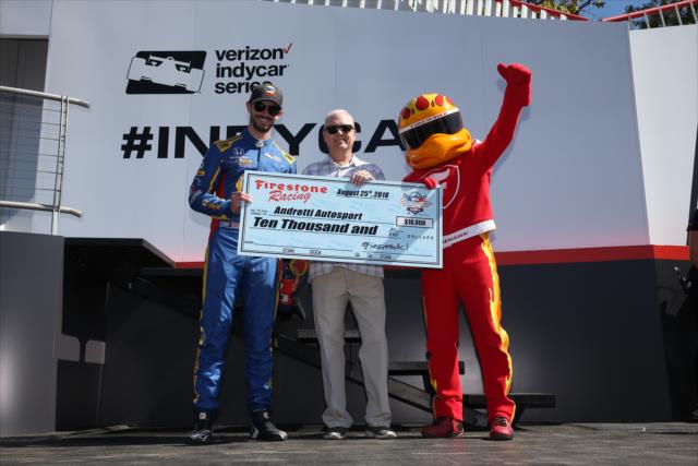 Alexander Rossi is presented the Firestone Pit Stop Performance Award on behalf of Andretti Autosport for their performance at Gateway -- Photo by: Chris Jones