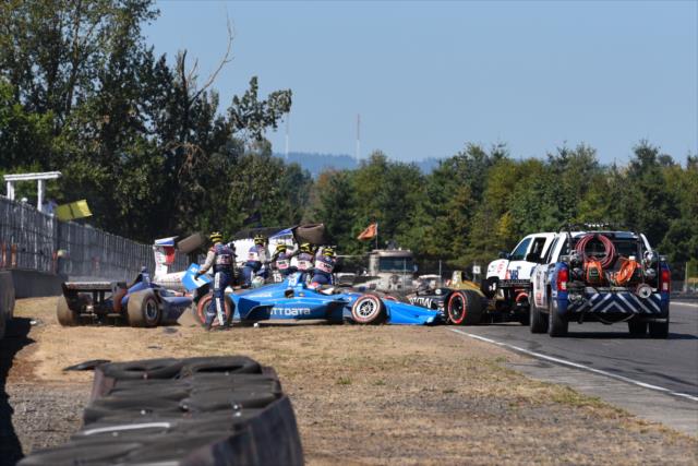 The AMR INDYCAR Safety Team help clear the Lap 1 carnage during the Grand Prix of Portland at Portland International Raceway -- Photo by: James  Black