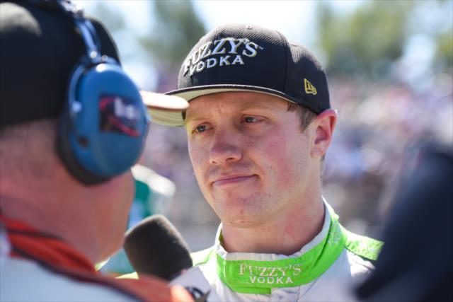Spencer Pigot is interviewed on pit lane after his 4th Place finish in the Grand Prix of Portland at Portland International Raceway -- Photo by: James  Black