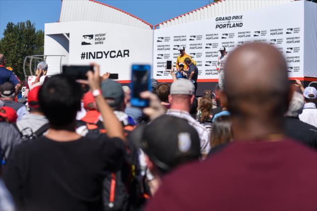 Fans pack Victory Circle as Takuma Sato is interviewed after winning the Grand Prix of Portland at Portland International Raceway -- Photo by: James  Black