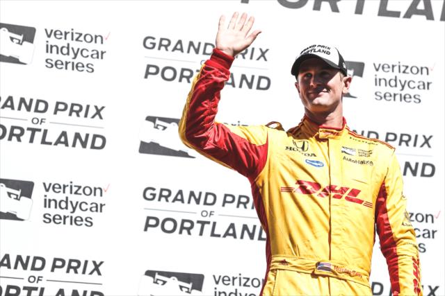 Ryan Hunter-Reay waives to the crowd in Victory Circle following his 2nd Place finish in the Grand Prix of Portland at Portland International Raceway -- Photo by: Joe Skibinski