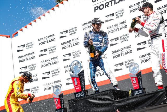 The champagne flows for Takuma Sato, Ryan Hunter-Reay, and Sebastien Bourdais in Victory Circle following the Grand Prix of Portland at Portland International Raceway -- Photo by: Joe Skibinski