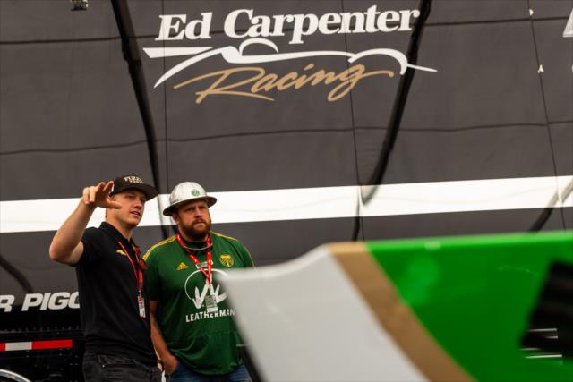 Timber Joey of the Portland Timbers visits with Spencer Pigot in the Ed Carpenter Racing paddock at Portland International Raceway -- Photo by: Stephen King