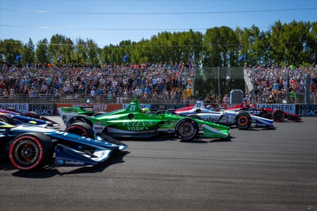 The field goes four-wide into Turn 1 at the start of the Grand Prix of Portland at Portland International Raceway -- Photo by: Stephen King