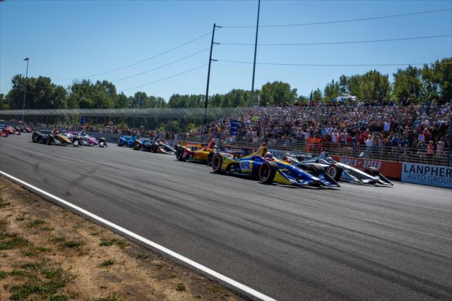 Alexander Rossi and Josef Newgarden lead the field into Turn 1 during the start of the Grand Prix of Portland at Portland International Raceway -- Photo by: Stephen King