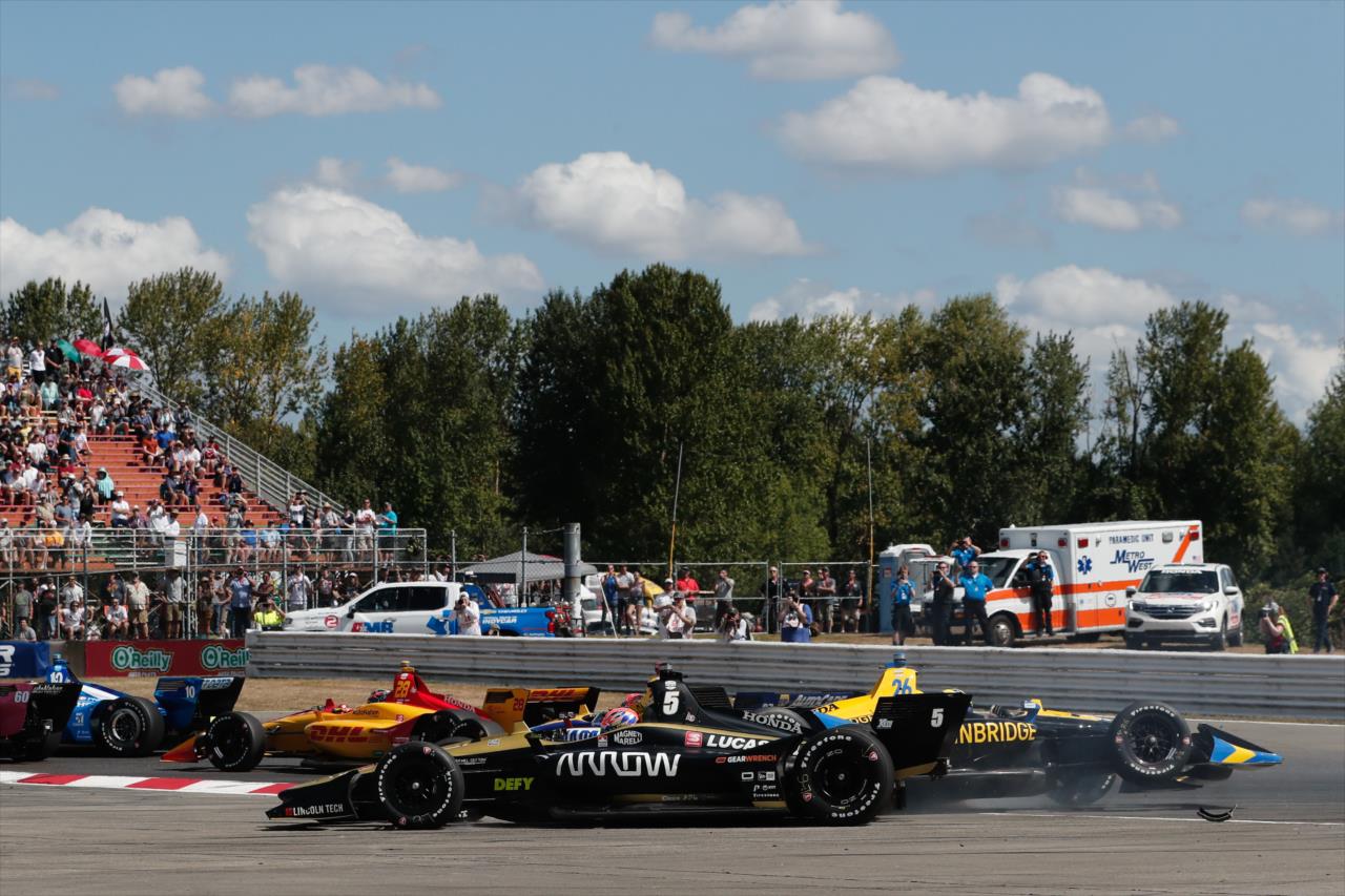 James Hinchcliffe and Zach Veach make contact on the opening lap -- Photo by: Joe Skibinski