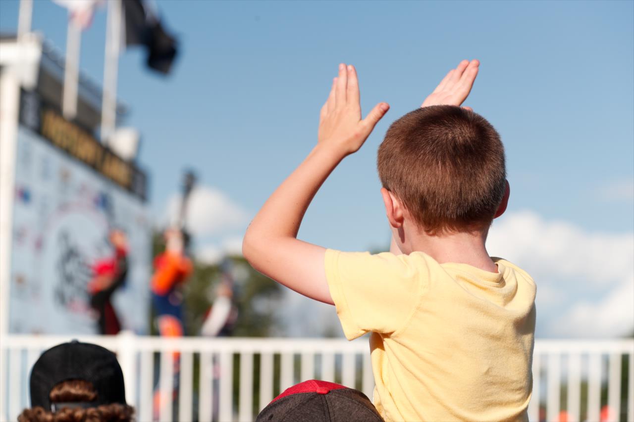 A young fan cheers on the podium for the REV Group Grand Prix Race 1 at Road America Saturday, July 11, 2020 -- Photo by: Joe Skibinski