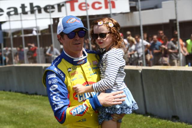Scott Dixon walks out with his daughter during pre-race festivities for the KOHLER Grand Prix at Road America -- Photo by: Chris Jones